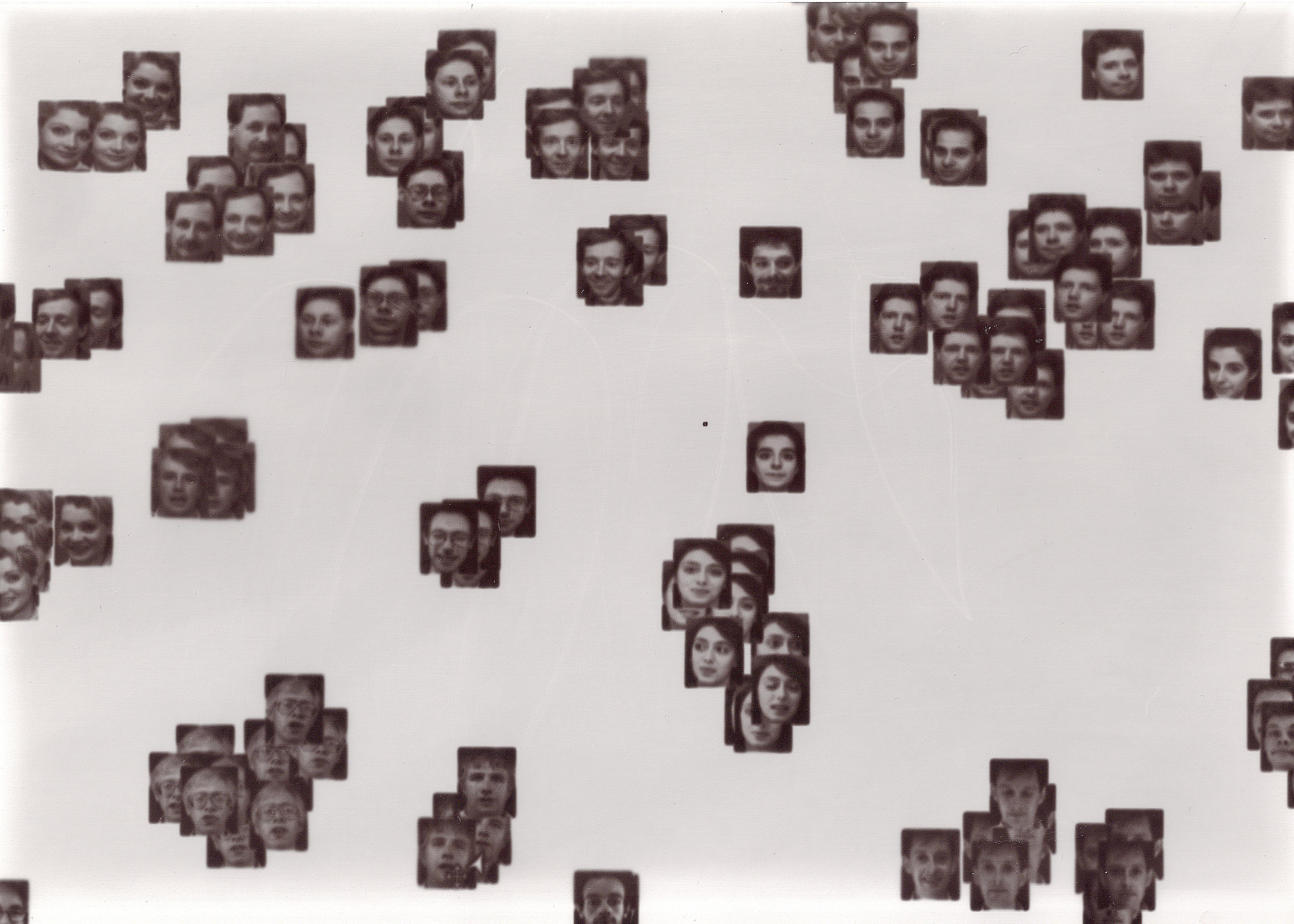 A laptopogram based on a neutral background and populated by scattered squared portraits, all monochromatic, grouped according to similarity. The groupings vary in size, ranging from single faces to overlapping collections of up to twelve. The facial expressions of all the individuals featured are neutral, represented through a mixture of ages and genders.